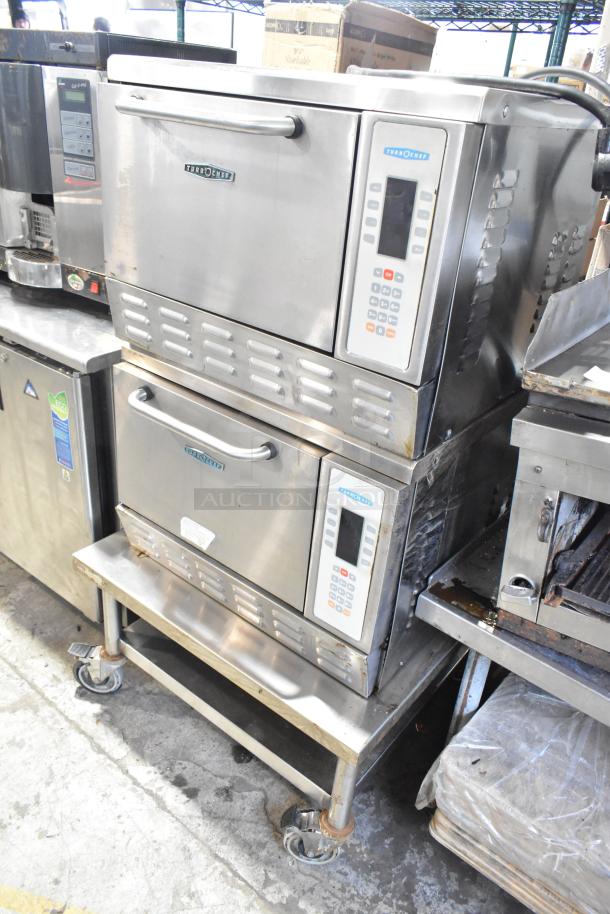 2 Turbochef NGC stainless steel rapid cook ovens on stand with commercial casters, 208/240V, 1 phase.