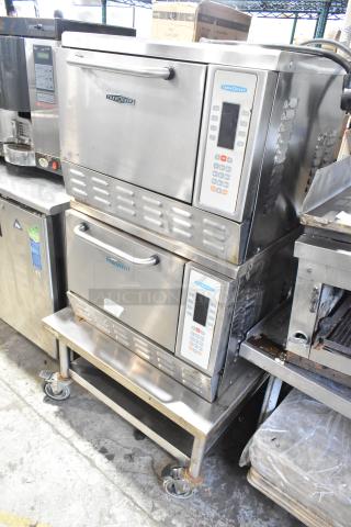 2 Turbochef NGC stainless steel rapid cook ovens on stand with commercial casters, 208/240V, 1 phase.