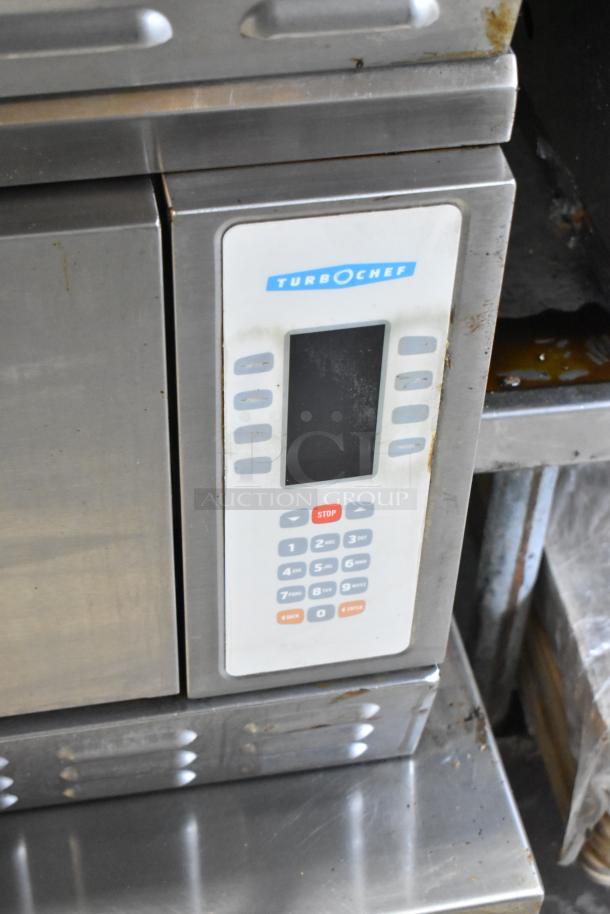 Turbochef NGC stainless steel rapid cook oven on stand with casters. Electric, 208/240V, 1 phase, visible wear.