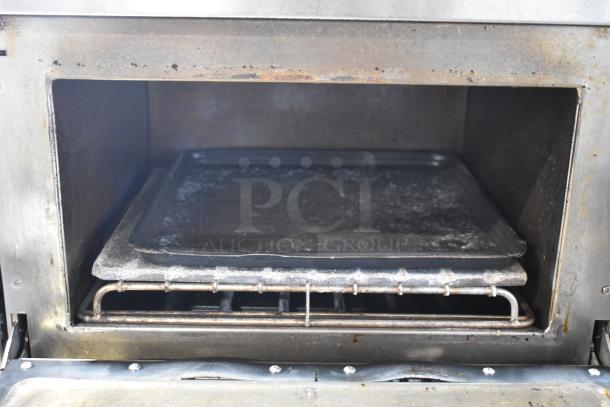 Turbochef NGC stainless steel rapid cook oven interior. Electric, 208/240V, 1 phase. Mounted on equipment stand with casters.