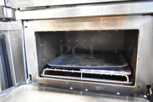 Turbochef NGC stainless steel rapid cook oven interior, showing tray and rack. Signs of use visible inside.