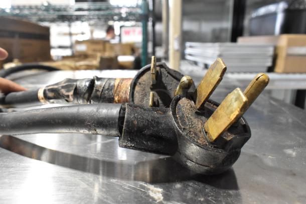 Close-up of rusted electric plug components for a Turbochef NGC Rapid Cook Oven, showing wear and industrial use.