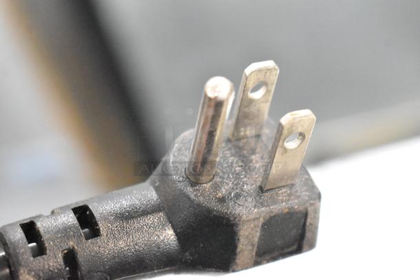 Close-up of a three-prong plug for the HZB-45 Stainless Steel Commercial Ice Machine, 115 Volts, 1 Phase.