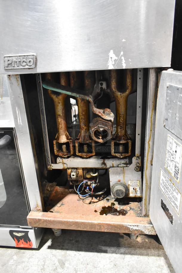 Pitco Frialator 40C fryer interior showing rusty components and wiring. Stainless steel exterior with visible logo.