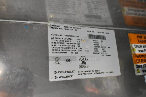 2020 Delfield 18MC32P-BI stainless steel prep table, 115V, 1 Phase, commercial casters, label with specs and certifications.