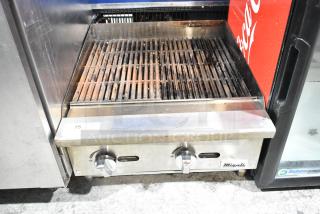 Migali stainless steel commercial countertop gas charbroiler grill with adjustable knobs. Used condition. Model label visible.