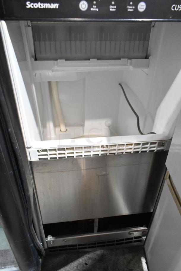 2021 Scotsman CU50GA-1C stainless steel ice machine, self-contained, 115 volts, 1 phase, clean interior, control panel visible.