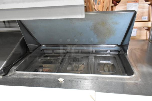 Delfield stainless steel prep table with four drawers, over-shelf, bain marie mega top. Used, 115 volts, 1 phase.