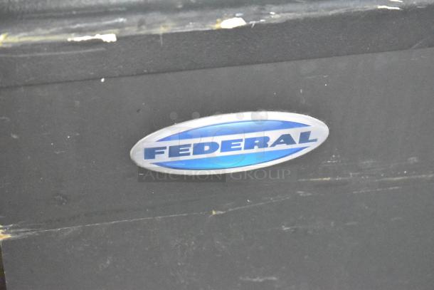 Federal Metal Commercial Floor Style Horizontal Grab N Go Merchandiser, metallic black finish, oval Federal logo on unit.