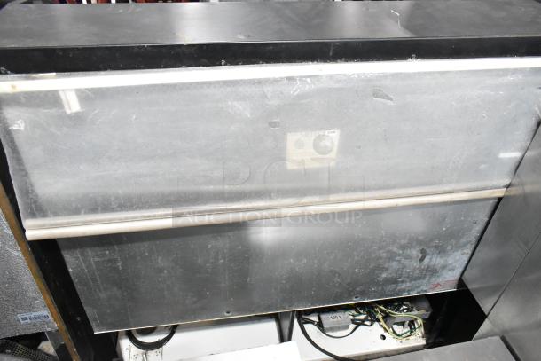 Federal metal Grab N Go merchandiser, commercial floor style, horizontal layout, visible wear, power label: 120V.