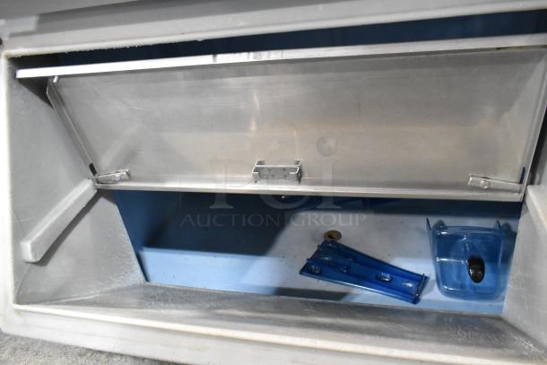 Manitowoc SY1805W stainless steel commercial ice head on bin, showing interior. 208-230V, 1 phase. Good condition.