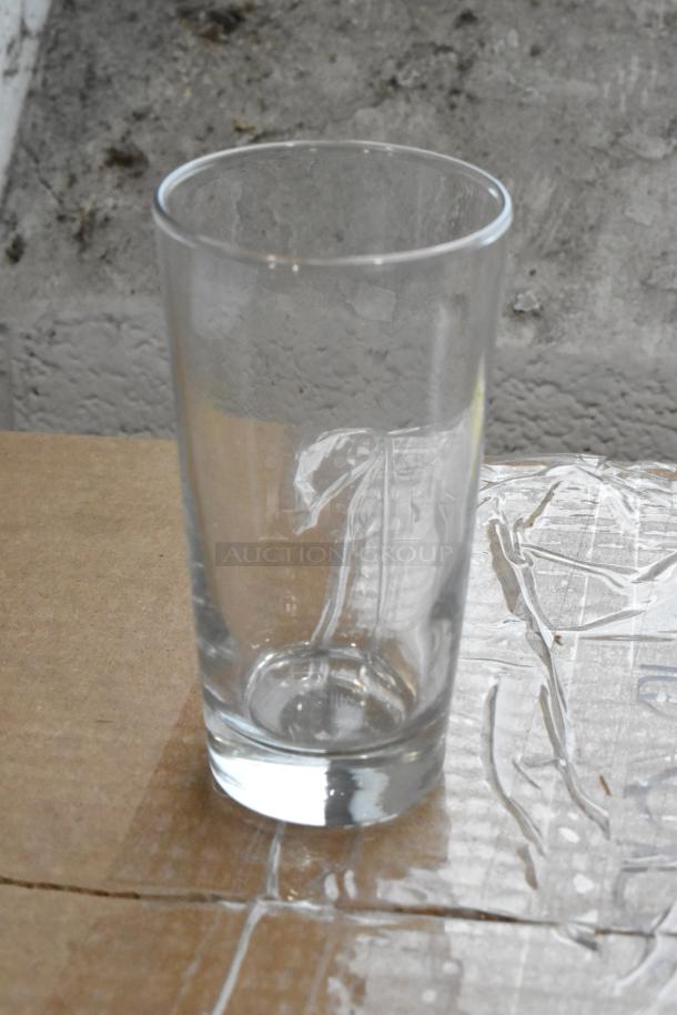 Brand new Libbey 133 Heavy Base 9 oz. Highball glass displayed on cardboard surface.
