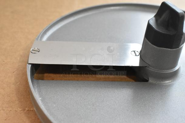 Brand new scratch and dent Robot Coupe E10 S3/8 metal slicing blade, designed for food processors, circular shape, minor wear.