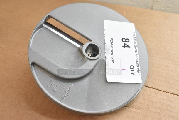 Brand new Robot Coupe E10 S3/8 metal slicing blade for food processor. Minor dents; marked "E10 S3/8" and "Robot Coupe."