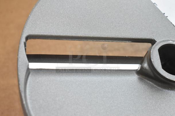 BRAND NEW Robot Coupe E10 S3/8 metal slicing blade for food processor, with minor scratches, high-quality metal finish.