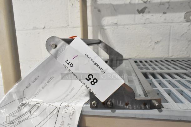 Brand new scratch and dent metal access door for conveyor pizza oven. Includes instructions, marked tag showing quantity and auction info.