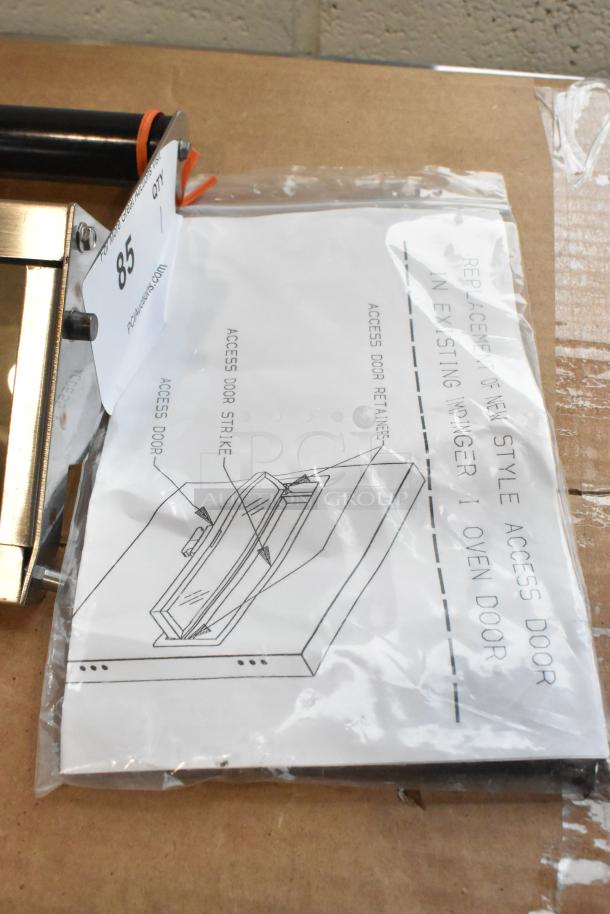 Brand new metal access door for conveyor pizza oven, labeled "scratch and dent." Includes installation guide.