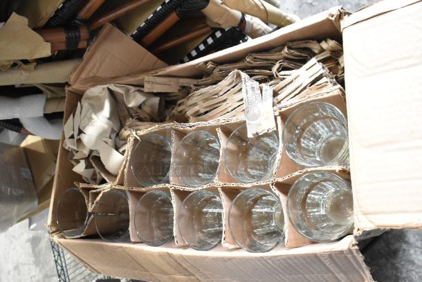 Box of glassware including brand new Libbey Gibraltar and Lexington glasses, and Acopa Select Flora wine glasses, in original packaging.