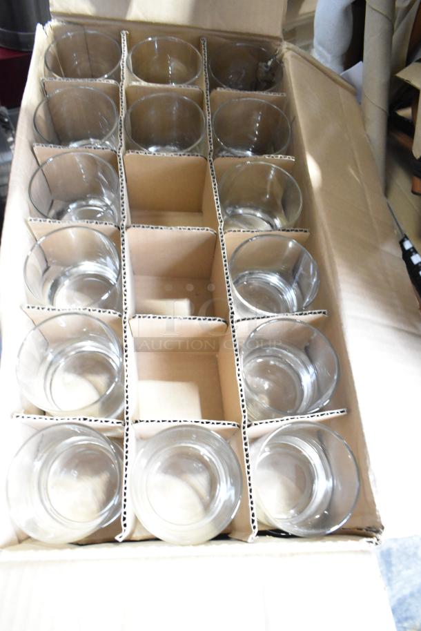 Box of brand-new Libbey Gibraltar 12 oz. beverage glasses, Libbey 2338 Lexington 10.25 oz. rocks glasses, and Acopa Select Flora 19 oz. wine glasses.