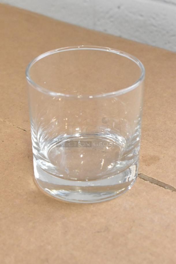 Libbey Lexington 10.25 oz. Rocks Glass on brown surface, clear glass, new condition, scratch and dent sale.