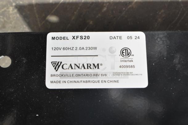 "Canarm model XFS20 label showing 120V, 60Hz, 2.0A, 230W specifications. ETL certified, made in China."