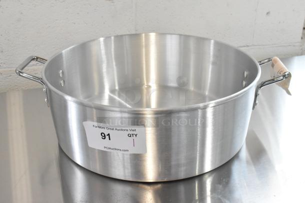 Brand new Town 34616 18 Qt. aluminum steamer water pan with handles, minor dents, and auction label "91".