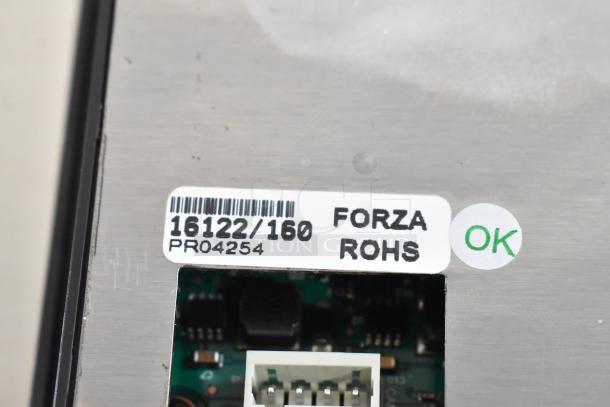 Monitor with labels showing "16122/160," "FORZA," and "ROHS." Marked "OK." Scratch and dent, new condition.