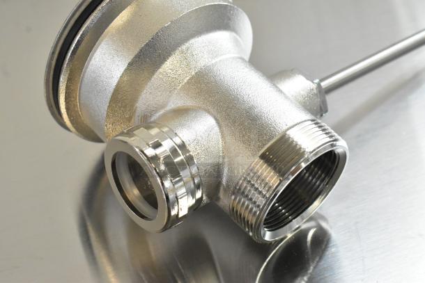 Shiny, metal drain fitting with threaded ends, new condition with minor scratches. Includes three pieces.
