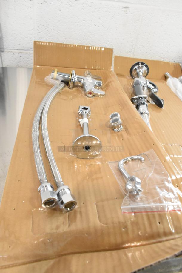 Brand new spray nozzle attachment, chrome finish, includes hoses and fittings. Scratch and dent condition, boxed.