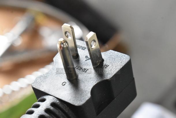 Close-up of the power plug from the Avantco 184THD27208 4-Slice Commercial Toaster, 208V, showing prongs and markings.