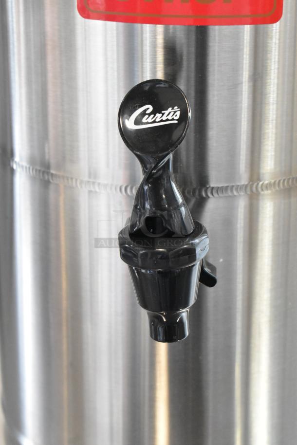Brand new Curtis SW-2 syrup warmer, 2-gallon capacity, stainless steel, slight scratches, visible Curtis tap.