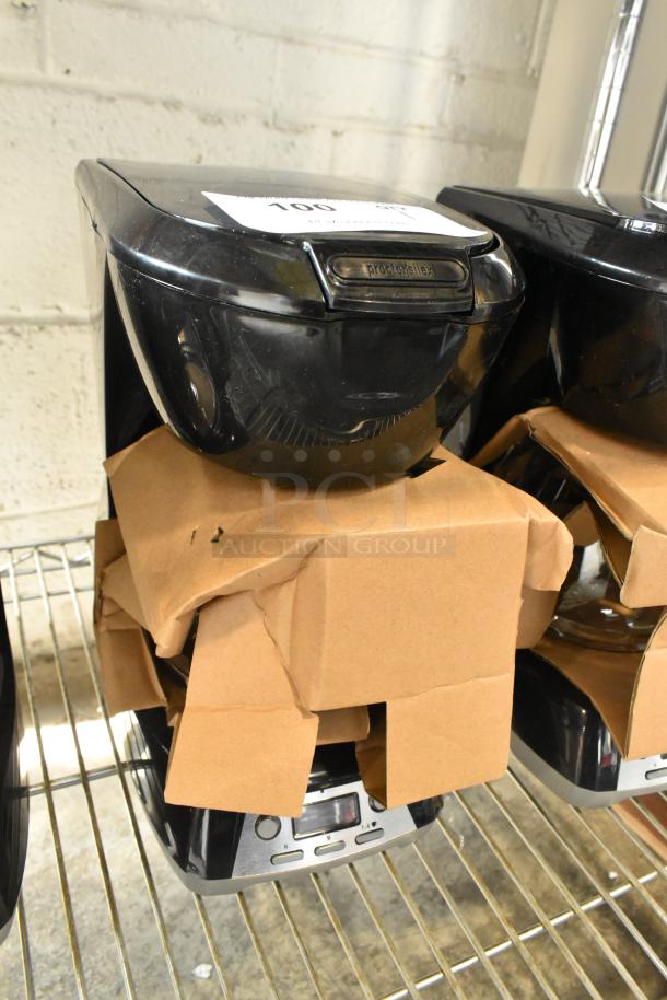 Brand new Proctor Silex 43672PS 12-cup programmable drip coffee maker, 120V, with minor scratches and dents, in packaging.