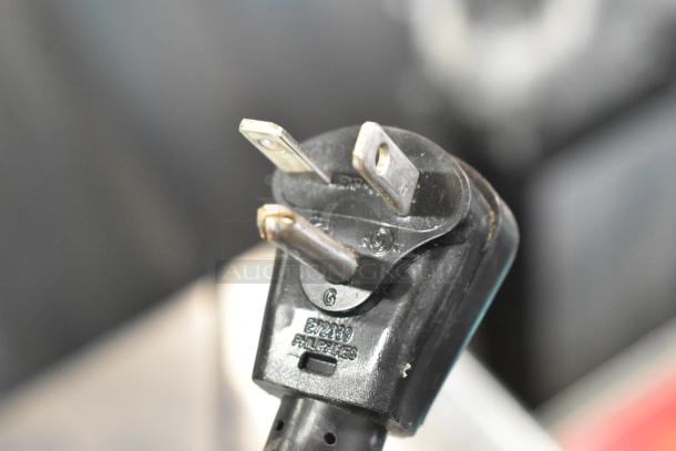 Close-up of a power plug for the 2025 Solwave SWA18T medium-duty commercial microwave, 208/240 volts, 1 phase.