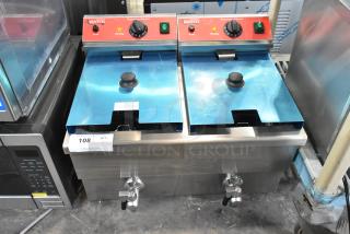 Brand new 2024 Avantco 177F202 dual tank electric countertop fryer, 30 lb., with two metal fry baskets, 208-240V, scratch and dent condition.