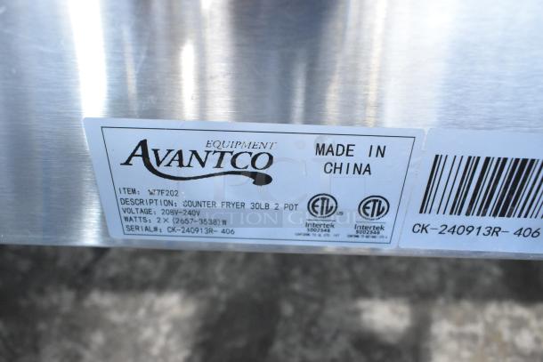 Brand new Avantco 177F202 30 lb. dual tank countertop fryer with 2 baskets and lids. Voltage: 208-240V, 1 Phase. Made in China.