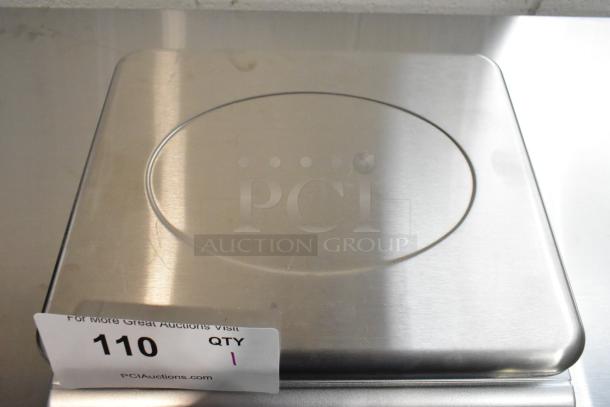 Brand new San Jamar Escali SCDGM66 digital kitchen scale, 66 lb. capacity, stainless steel, minor blemishes. Auction tag visible.