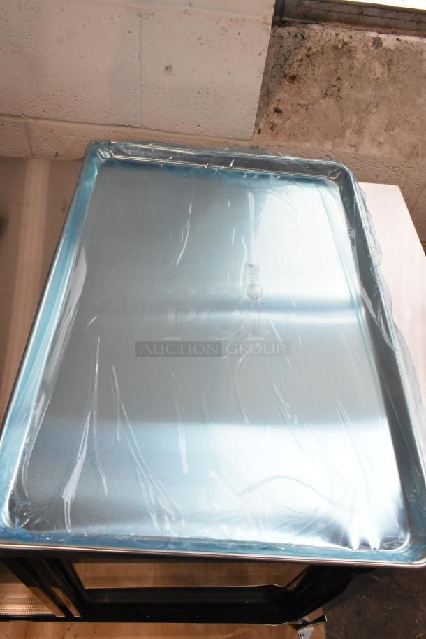 Brand new Choice full-size 18"x26" 19-gauge aluminum bun pan, wrapped in protective plastic. Perfect condition.