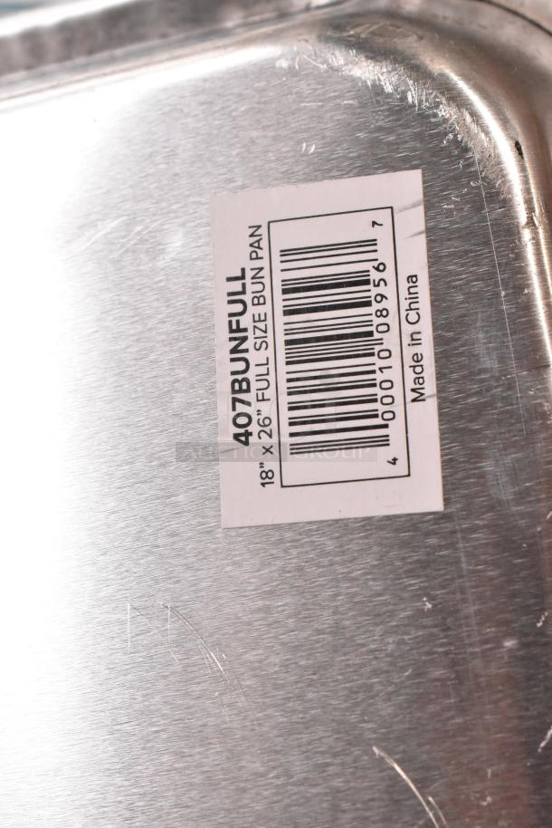Close-up of a label on a 407BUNFULL Choice full-size 18" x 26" aluminum bun pan. The label indicates it's made in China.
