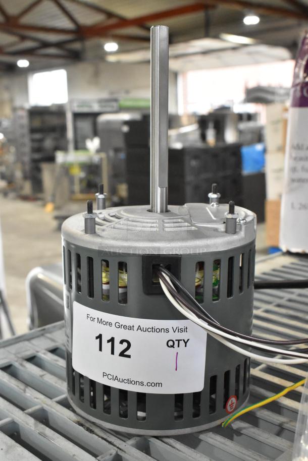 Brand new East West YDK140/20-2-75B1 motor, 208-240V, 1 phase, with minor scratches and dents. Auction tag visible.
