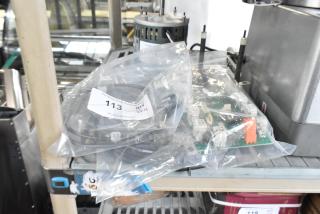 Brand new items including burner, KX-234-36, Pratica HW000110 circuit board, in bags. Auction tag 113 visible.