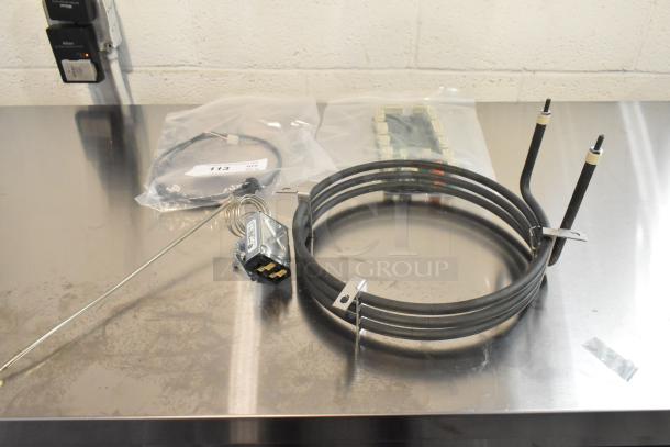 4 brand new scratch and dent items including a burner, KX-234-36, Pratica HW000110 circuit board; auction lot.