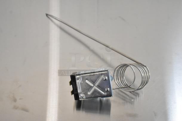 Brand new stainless steel burner component, rectangular and X-braced, with coiled tubing. Scratch and dent condition.