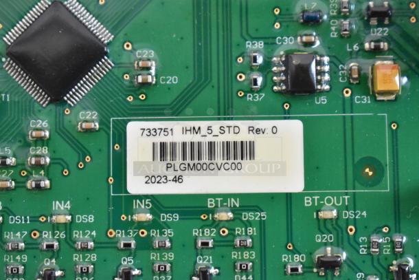 Close-up of Pratica HW000110 circuit board with components and labeled sticker showing model number and revision details.
