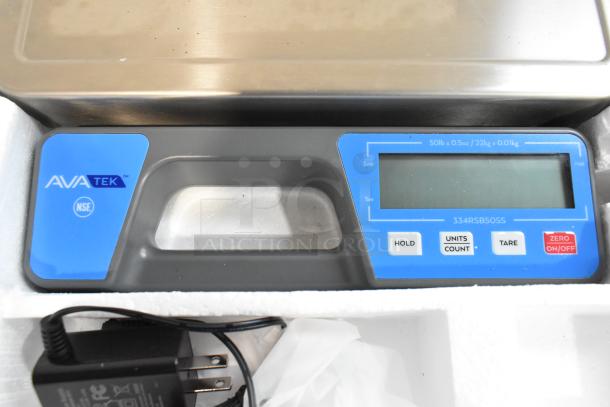 Brand new AvaTek 334RSB50SS 50 lb. digital portion scale, scratch and dent, with built-in handle and power adapter.