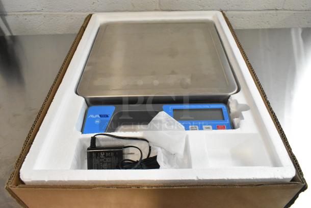 AvaTek 334RSB100SS 100 lb. digital scale in box, new condition, with built-in handle and power adapter.