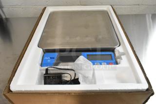 AvaTek 334RSB100SS 100 lb. digital scale in box, new condition, with built-in handle and power adapter.