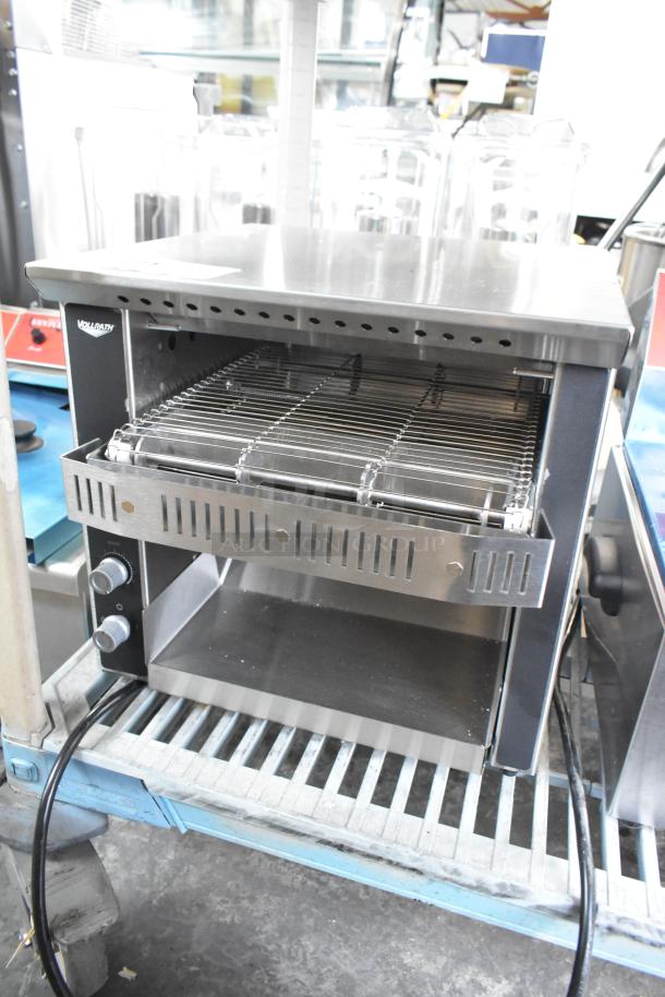 Brand new Vollrath JT1H stainless steel conveyor toaster, 2 1/2" opening, 120V, 1 phase, slight scratch and dent.