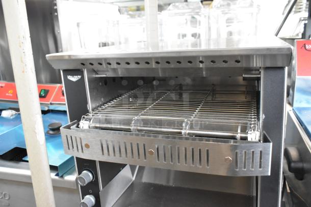 Brand new Vollrath JT1H stainless steel conveyor toaster with a 2 1/2" opening, 120 volts, 1 phase, minor scratches.