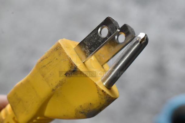 Close-up of a three-prong plug from the 506602 HT-6EN-CIA-FS Submersible Pump, showing slight scuffs.