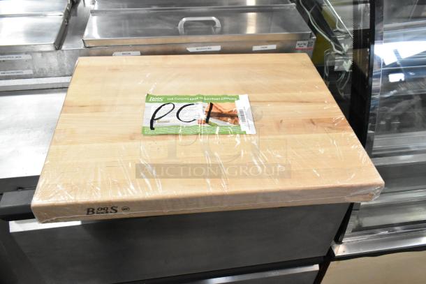 Brand new John Boos RA03 reversible maple cutting board, 24"x18"x2.25", hand grips, some scratches and dents, wrapped in plastic.